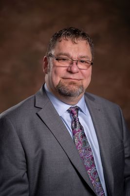 Portrait of Jason Chester, Associate.